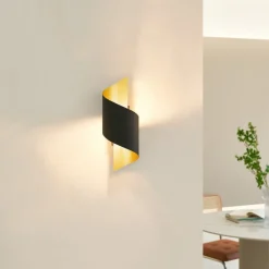 Gang|Pendellamper ^ Lindby væglampe Desirio, sort/guld, 24 cm, metal