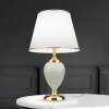 ORION Bordlamper > Ovum bordlampe, hvid/guldfarvet, højde 48 cm, keramik/chintz